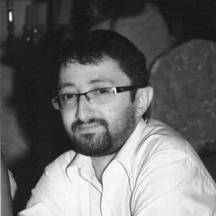 Black and white headshot of Firat Sekerli