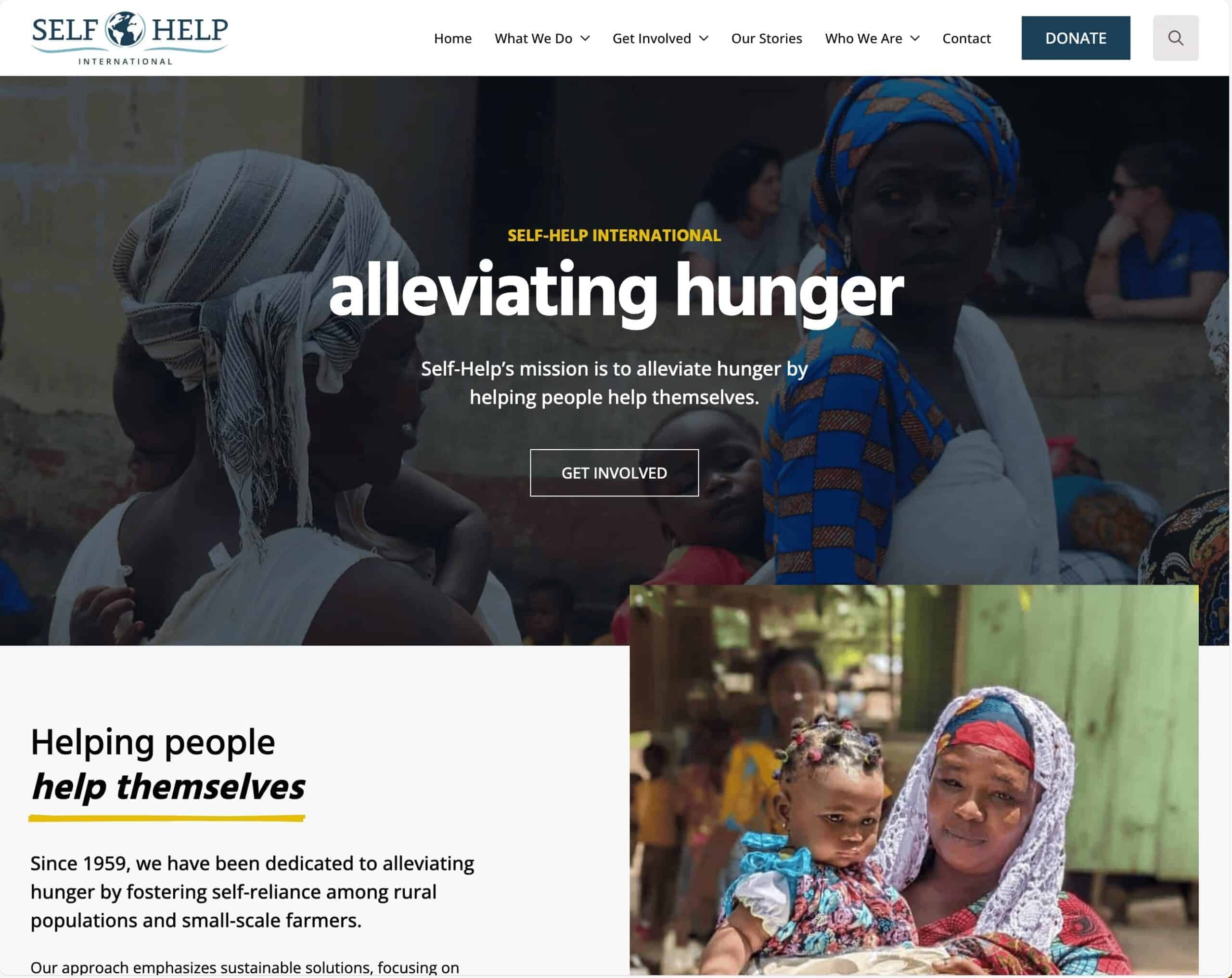 Group of women and children in a rural setting, highlighting community efforts to combat hunger and promote self-sufficiency.